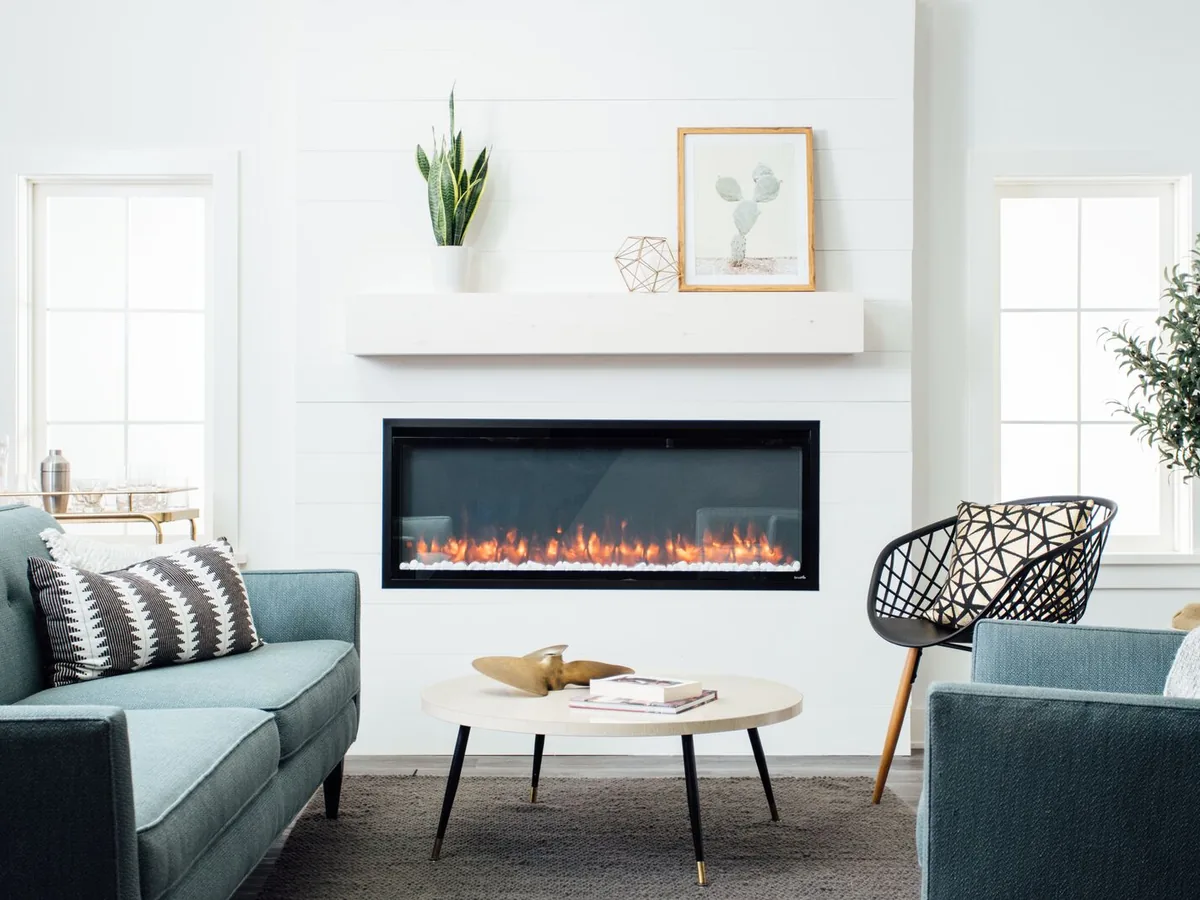 SimpliFire Allusion linear electric fireplace on a white wall in a modern living room